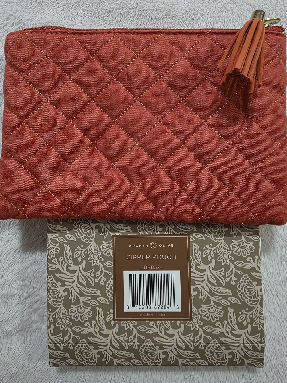 Archer & Olive Quilted Rust Colored Zipper Pouch with Tassel